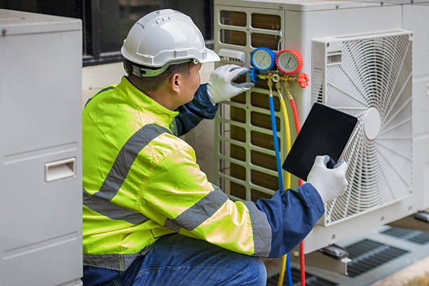 Professional Air Duct Cleaning technician working in Iowa City, IA